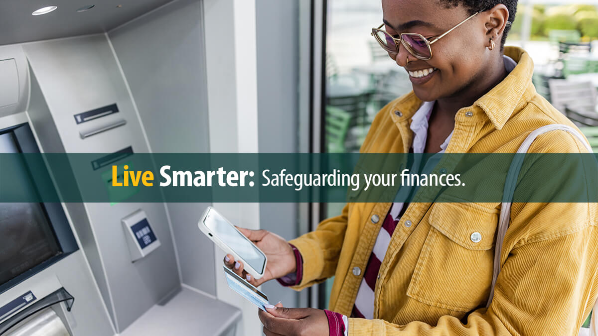 African American woman is withdrawing money at the outdoor ATM.